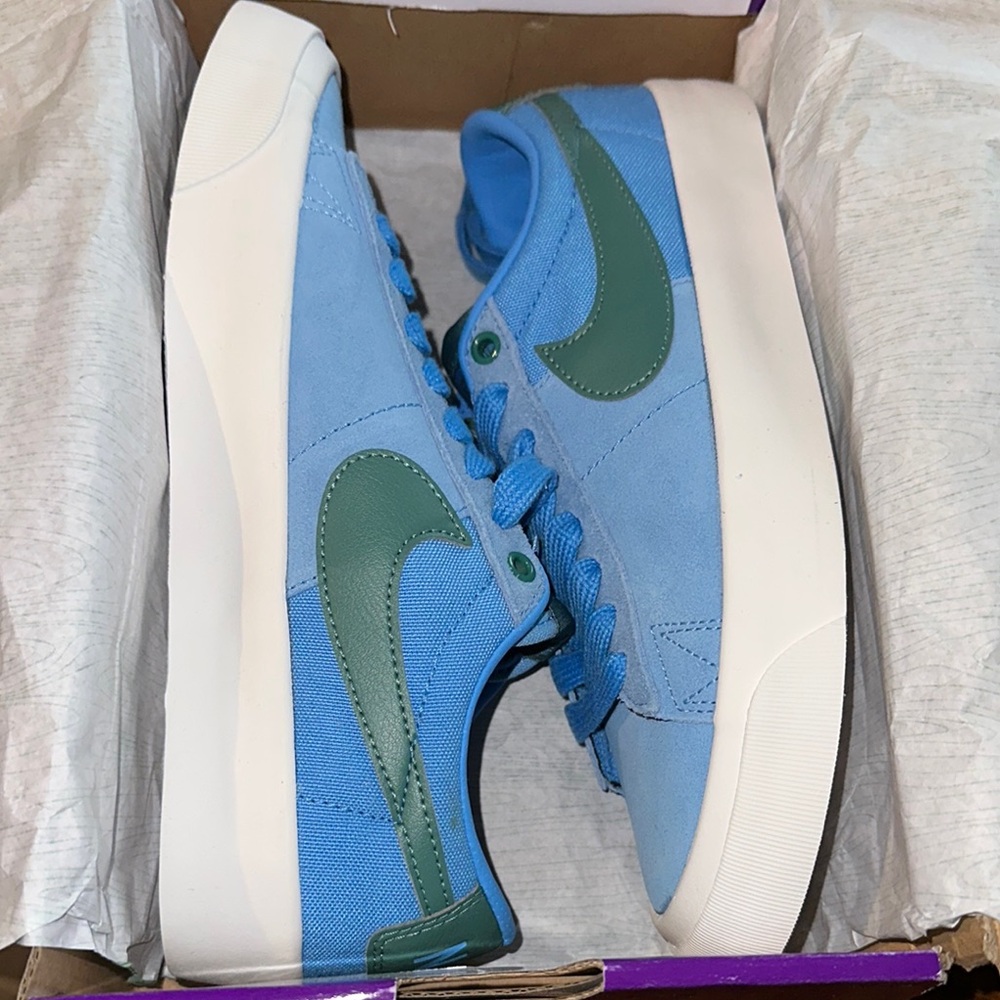 Blue and Green nike shoes